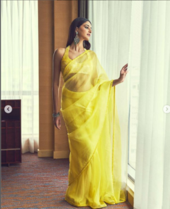 Ananya Pandey looks breathtaking in a stunning yellow saree paired with a halter neck blouse, solidifying her position as an absolute embodiment of beauty.